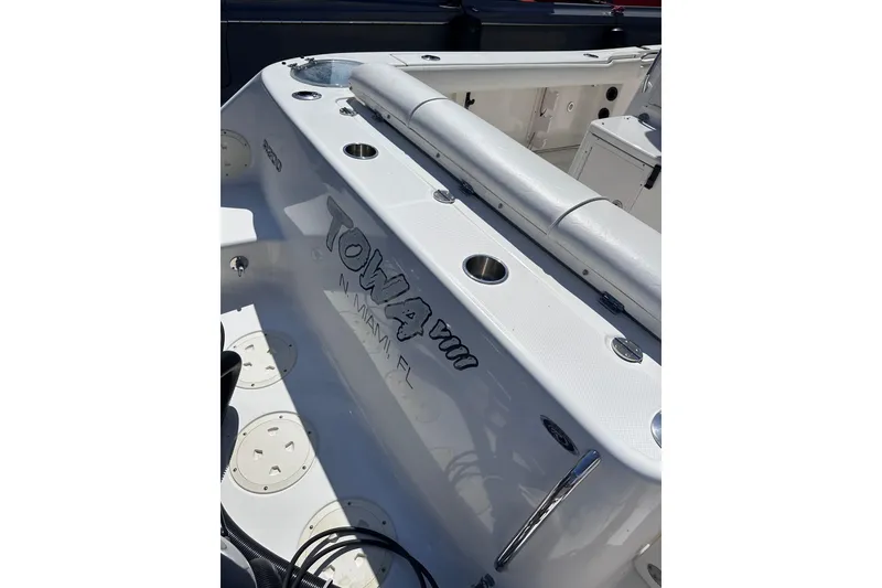 Slide: The Image of 2011 Robalo R300 Center Console boat interior with seating and cup holders. - 12