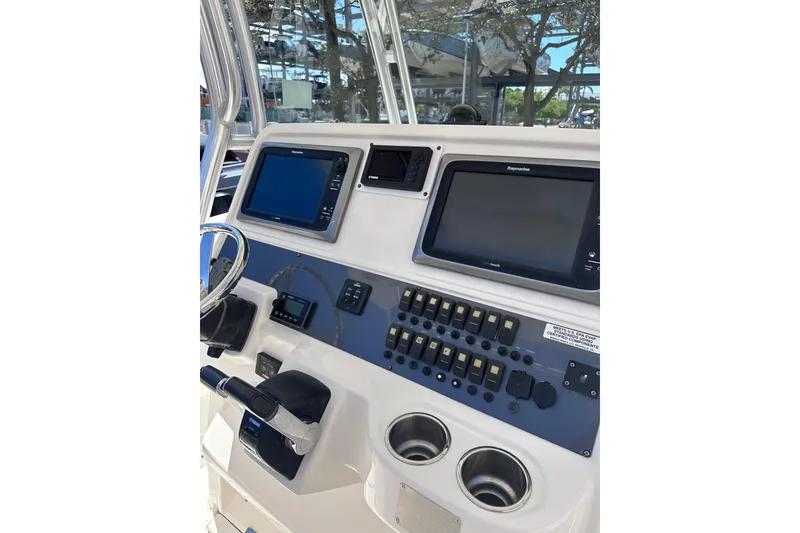 Slide: The Image of 2011 Robalo R300 Center Console dashboard with navigation screens and controls. - 15