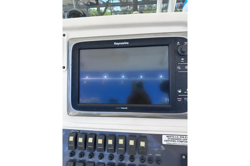 Slide: The Image of Raymarine display on 2011 Robalo R300 Center Console boat dashboard. - 16
