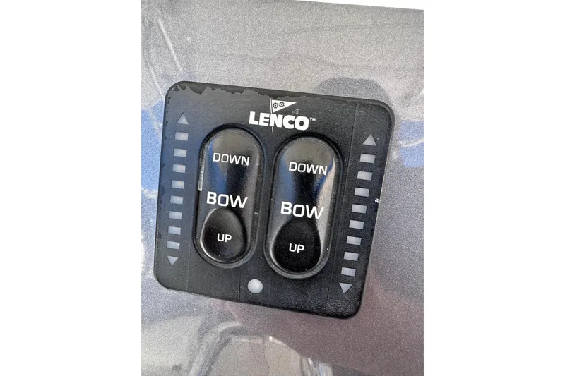 Slide: The Image of Lenco trim tab control panel on 2011 Robalo R300 Center Console boat. - 19