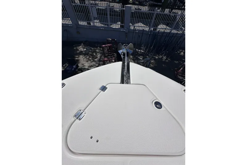 Slide: The Image of Bow of 2011 Robalo R300 Center Console boat with anchor and hatch. - 26