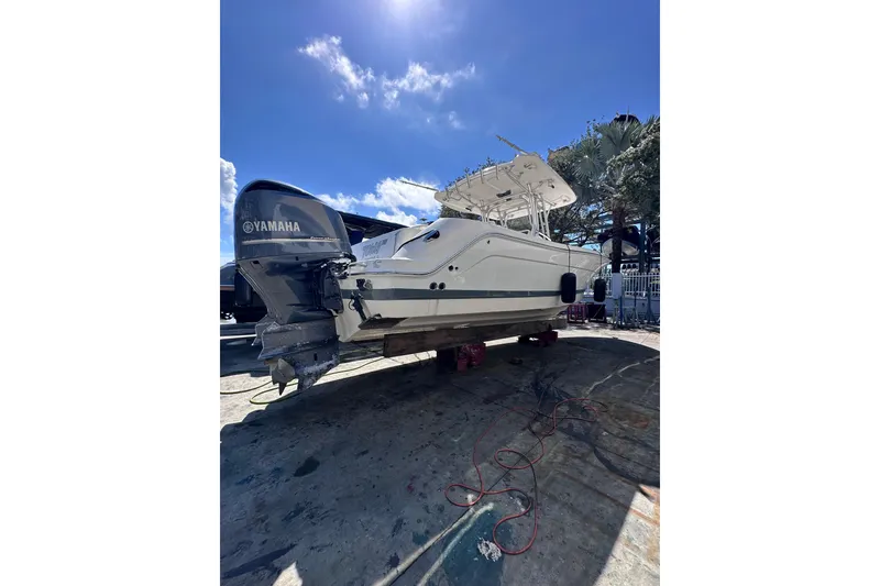 Slide: The Image of 2011 Robalo R300 Center Console boat with Yamaha engine on dry dock. - 3