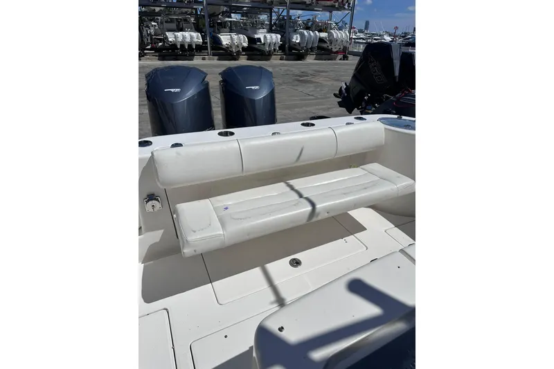 Slide: The Image of 2011 Robalo R300 Center Console boat with cushioned seating and dual outboard motors. - 31