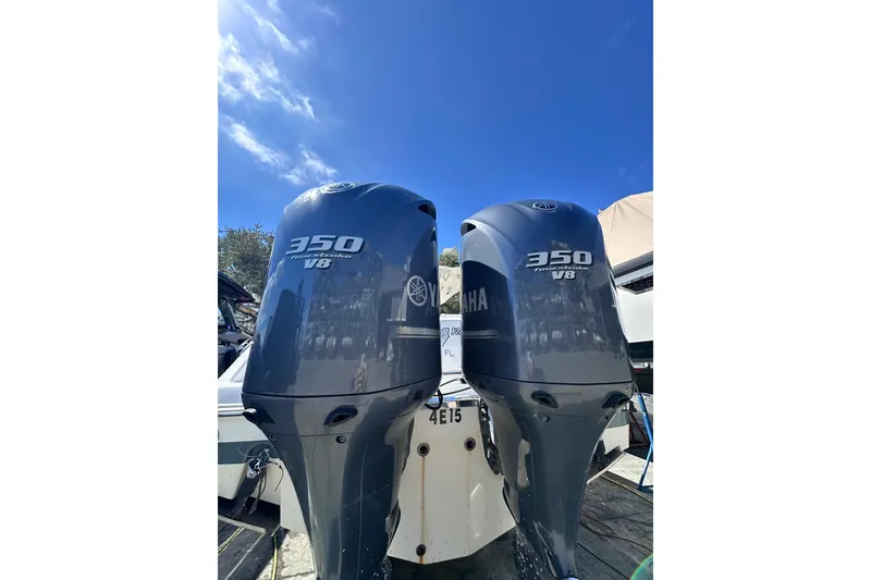 Slide: The Image of Twin Yamaha 350 V8 outboard engines on a 2011 Robalo R300 Center Console boat. - 9