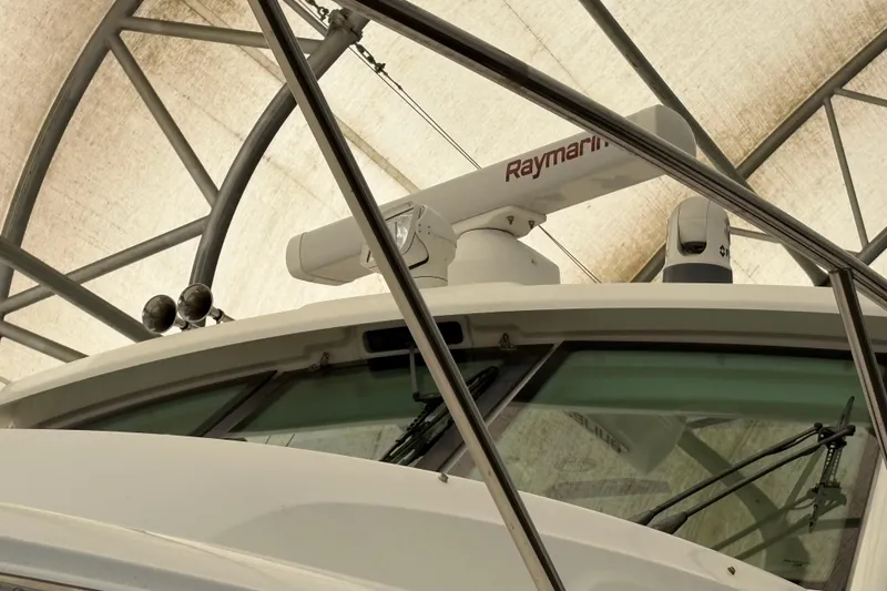 Slide: The Image of 2018 Boston Whaler 345 Conquest boat with Raymarine radar under a canopy. - 11