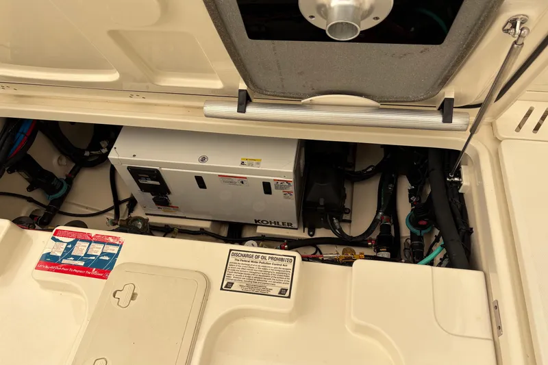 Slide: The Image of 2018 Boston Whaler 345 Conquest engine compartment with Kohler generator. - 16