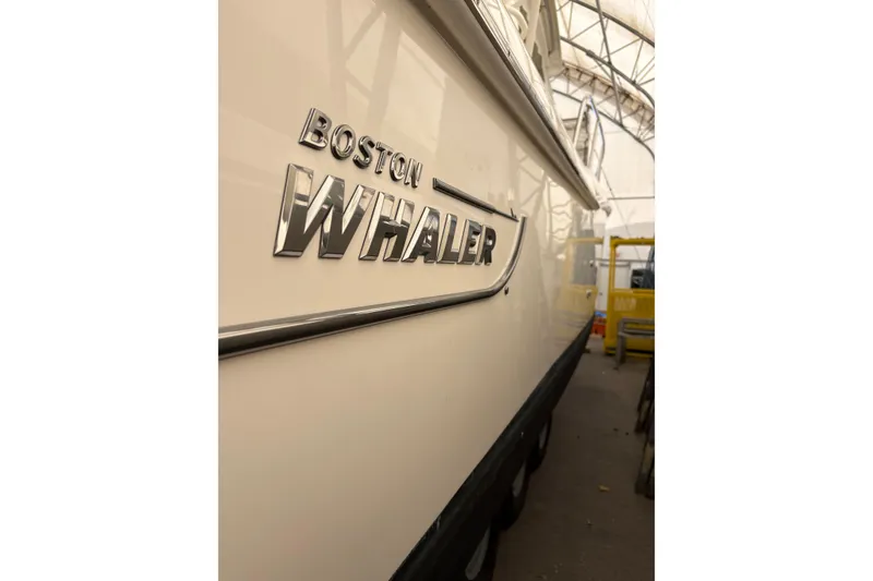 Slide: The Image of 2018 Boston Whaler 345 Conquest boat side view in storage facility. - 19