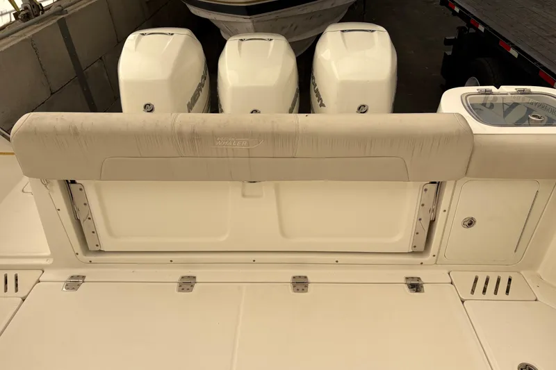 Slide: The Image of 2018 Boston Whaler 345 Conquest boat with triple Mercury outboard engines. - 23