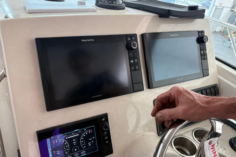 Slide: The Image of Triple Mercury Verado 350 engines on a 2018 Boston Whaler 245 Conquest boat. - 7