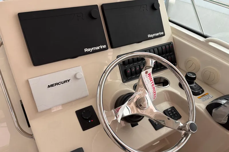 Slide: The Image of Control panel of a 2018 Boston Whaler 345 Conquest boat with Raymarine electronics. - 9