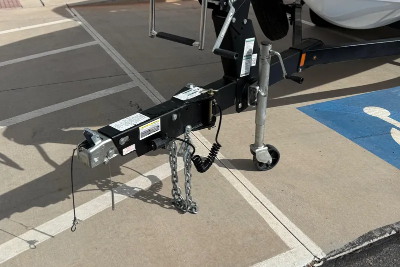 Slide: The Image of Trailer hitch of a 2022 Yamaha Boats 212XD on a parking lot. - 14