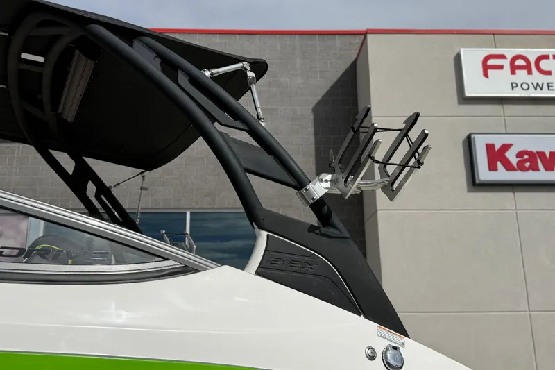 Slide: The Image of 2022 Yamaha Boats 212XD with wakeboard rack, displayed outside dealership. - 15