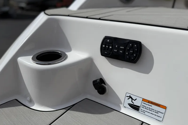 Slide: The Image of Control panel and cup holder on 2022 Yamaha Boats 212XD deck. - 18