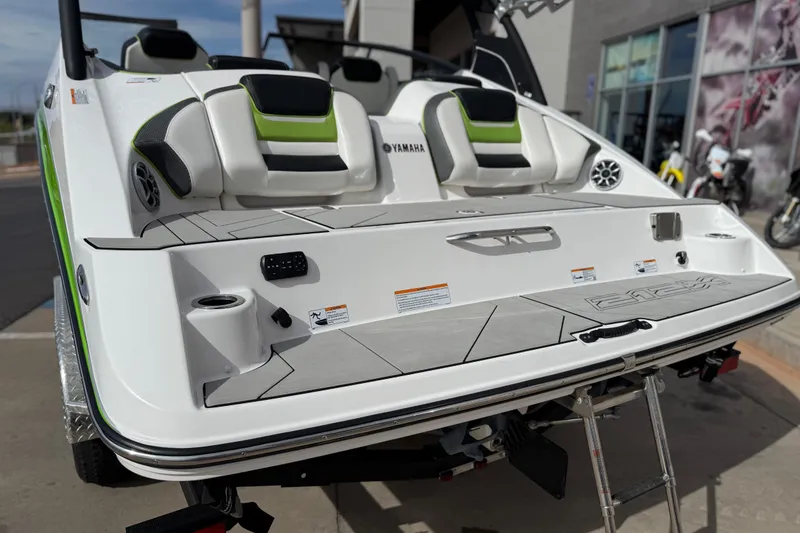 Slide: The Image of 2022 Yamaha Boats 212XD rear view with seating and swim platform. - 20