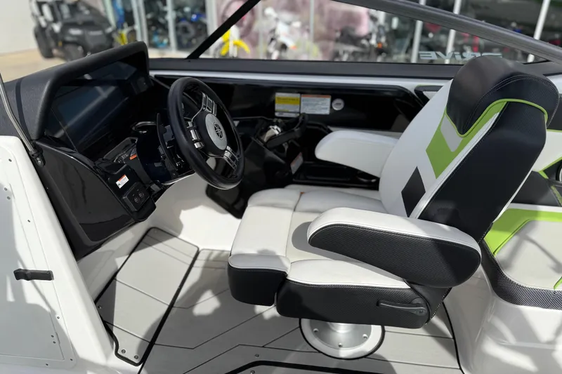 Slide: The Image of Interior of 2022 Yamaha Boats 212XD, featuring modern steering and seating design. - 34