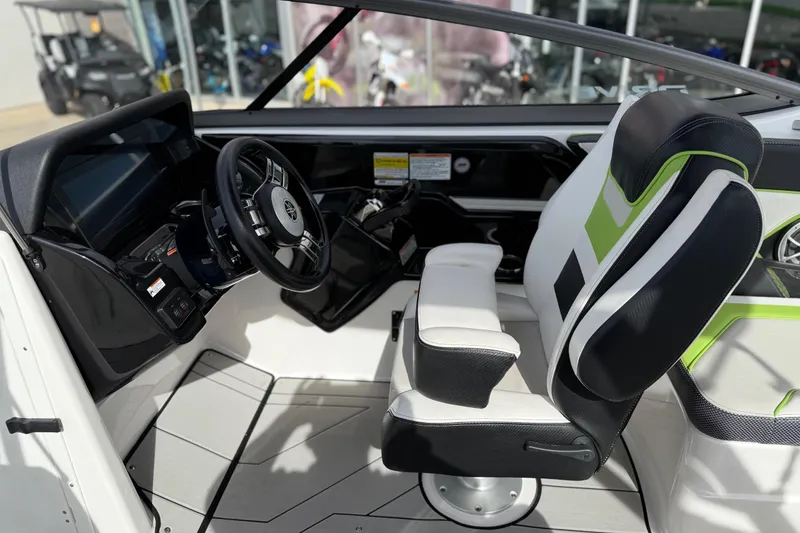 Slide: The Image of Interior of 2022 Yamaha Boats 212XD, featuring steering wheel and modern seating. - 35