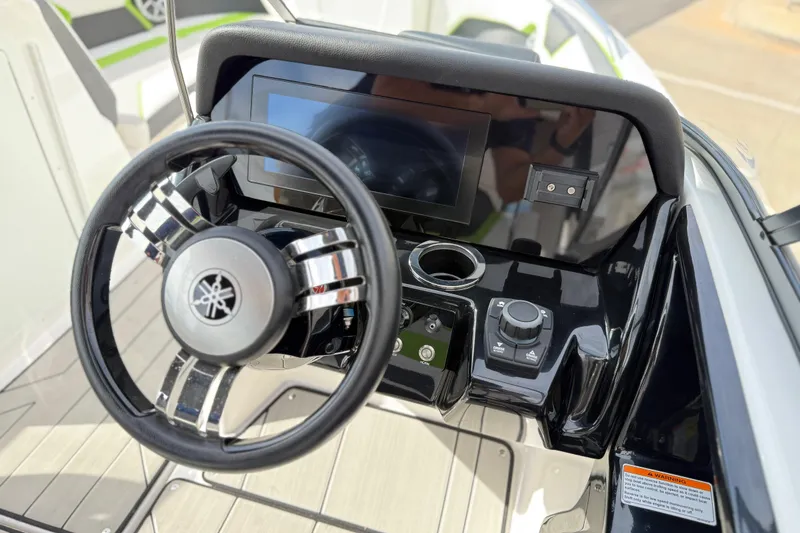 Slide: The Image of Steering console of 2022 Yamaha Boats 212XD with touchscreen and controls. - 40