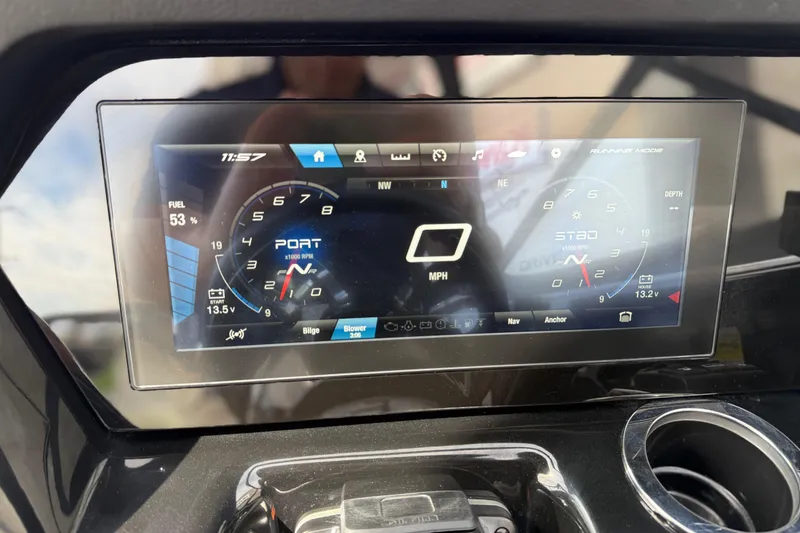 Slide: The Image of 2022 Yamaha Boats 212XD dashboard display showing fuel level, RPM, and navigation controls. - 42