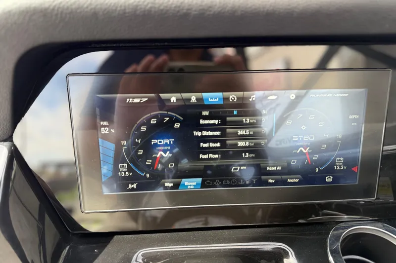 Slide: The Image of Dashboard of a 2022 Yamaha Boats 212XD showing fuel, economy, and trip data. - 44