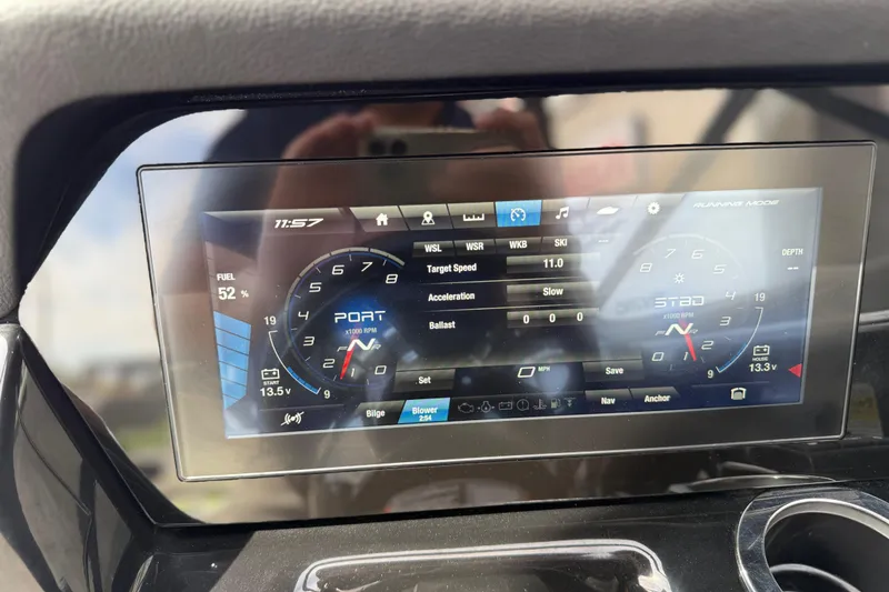 Slide: The Image of Dashboard of 2022 Yamaha Boats 212XD showing digital gauges and controls. - 45
