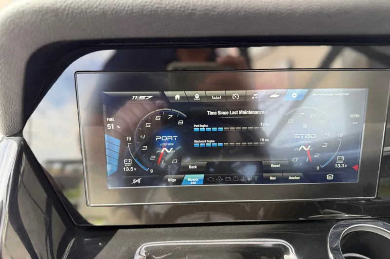 Slide: The Image of 2022 Yamaha Boats 212XD dashboard display showing fuel level and engine maintenance details. - 46