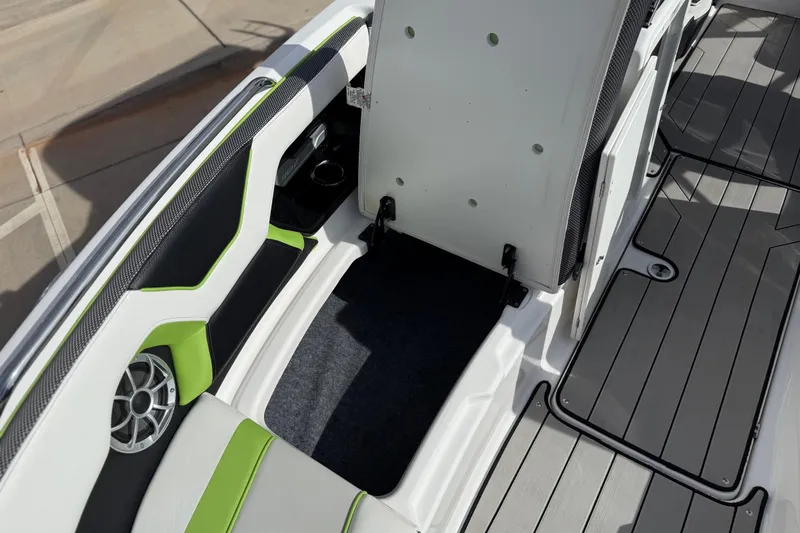 Slide: The Image of 2022 Yamaha Boats 212XD interior with green accents and speaker detail. - 53