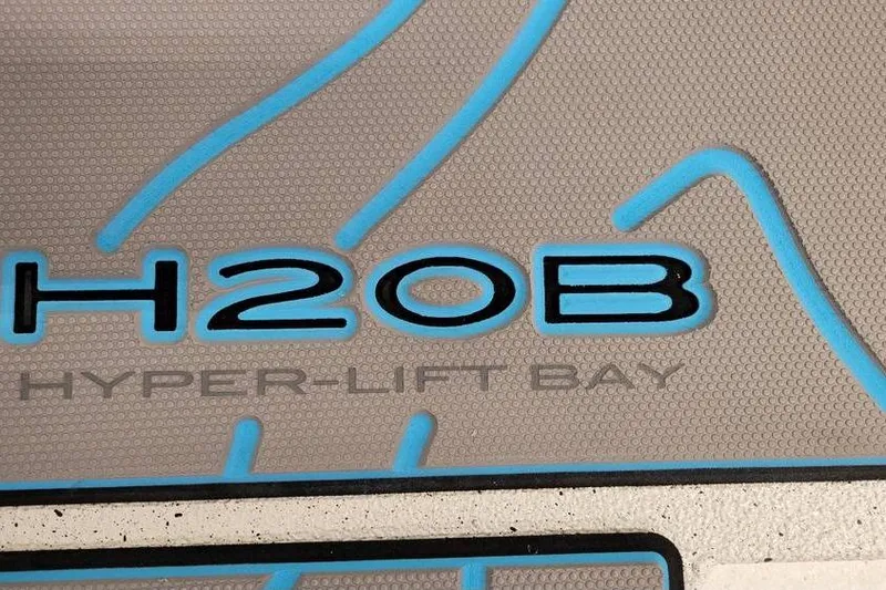 Slide: The Image of Xpress H20B Bay 2026 boat logo with blue accents and textured background. - 13