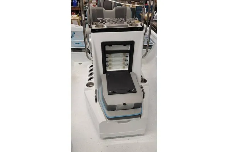 Slide: The Image of 2026 Xpress H20B Bay boat console with storage compartments and seating. - 18