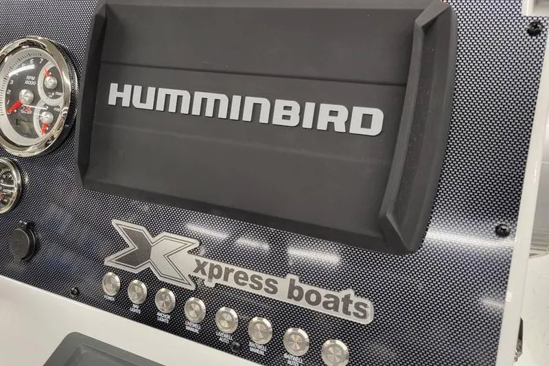 Slide: The Image of Dashboard of 2026 Xpress H20B Bay boat with Humminbird display and gauges. - 22