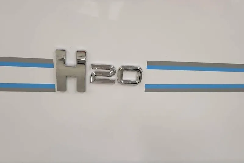 Slide: The Image of 2026 Xpress H20B Bay logo with blue and silver stripes on white background. - 3