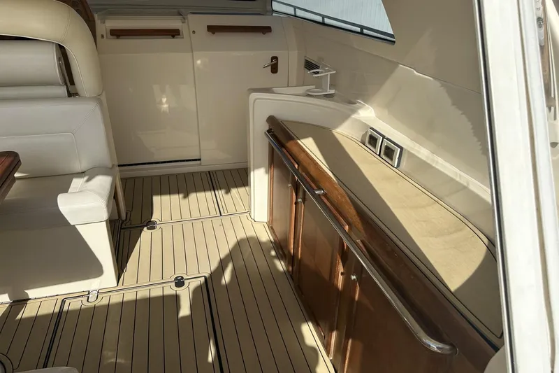 Slide: The Image of Interior of 2007 Mochi Craft 44 Dolphin yacht with elegant seating and wooden accents. - 10