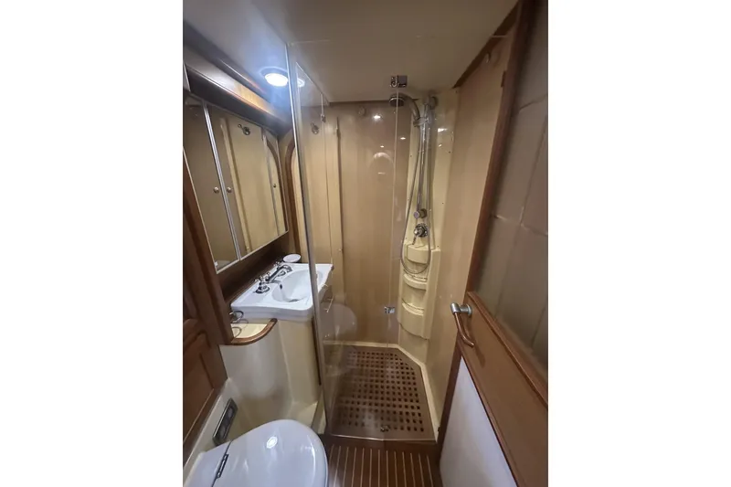 Slide: The Image of Luxurious bathroom in 2007 Mochi Craft 44 Dolphin yacht with shower and sink. - 21