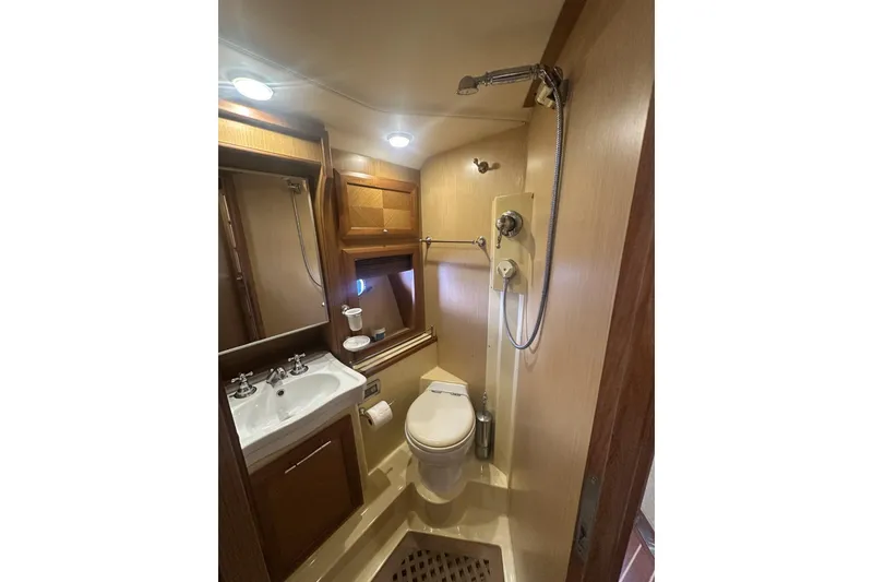 Slide: The Image of Luxurious bathroom in 2007 Mochi Craft 44 Dolphin yacht with modern fixtures. - 26
