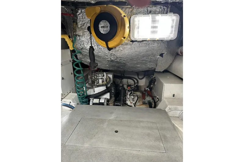 Slide: The Image of Engine room of 2007 Mochi Craft 44 Dolphin yacht, featuring mechanical components and insulation. - 27