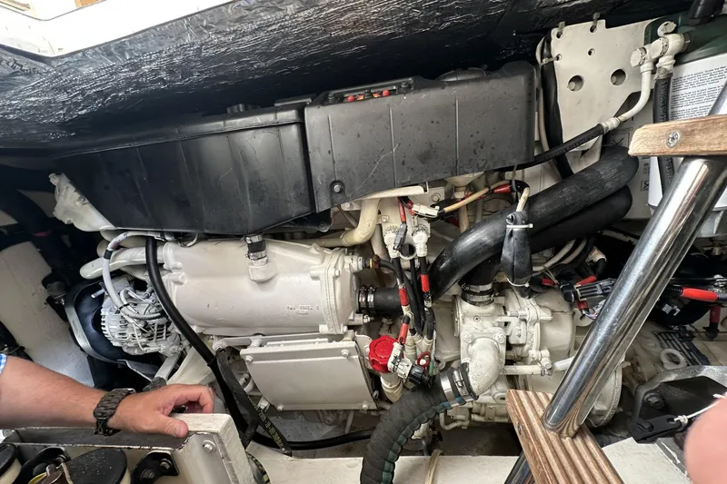 Slide: The Image of Engine compartment of a 2007 Mochi Craft 44 Dolphin yacht, showing detailed mechanical components. - 28
