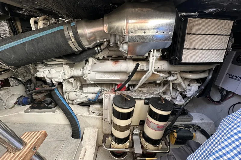 Slide: The Image of Engine compartment of 2007 Mochi Craft 44 Dolphin yacht, featuring Volvo Penta components. - 29