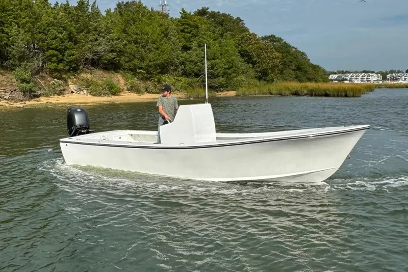 Slide: The Image of 2025 Privateer 20 Roamer boat cruising on a scenic waterway. - 11