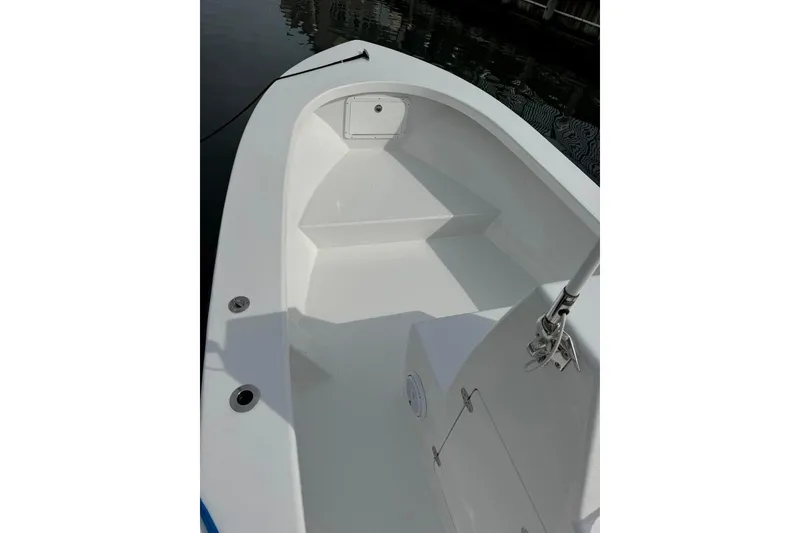 Slide: The Image of 2025 Privateer 20 Roamer boat interior, showcasing sleek white deck design. - 25