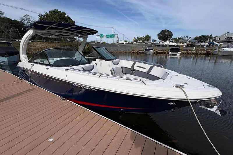 Slide: The Image of 2018 Chaparral 287 SSX boat cruising on a sunny day, rear view. - 10