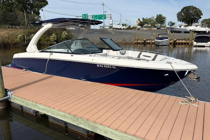 Slide: The Image of 2018 Chaparral 287 SSX boat cruising on a sunny lake. - 9