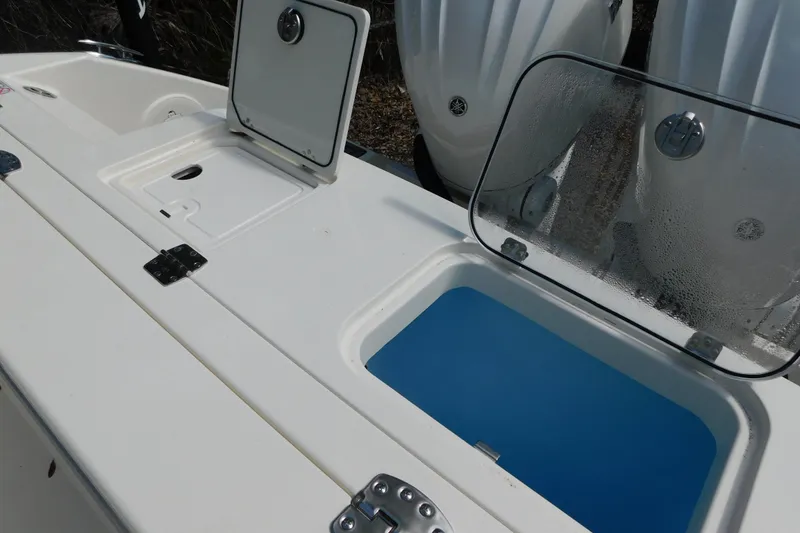 Slide: The Image of 2026 Cobia 285 Center Console boat with dual outboard engines, featuring a spacious deck layout. - 10