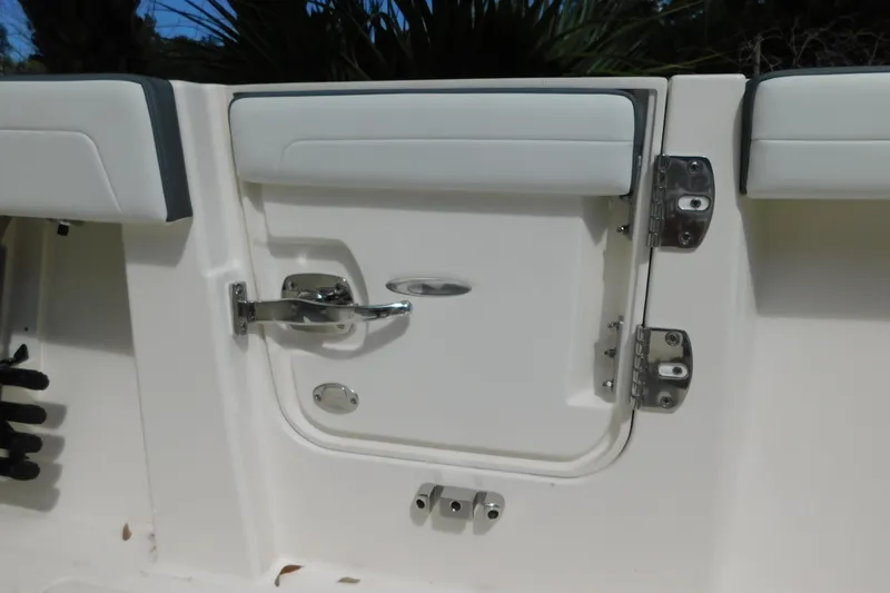 Slide: The Image of 2026 Cobia 285 Center Console boat interior with rod holders and storage compartments. - 13