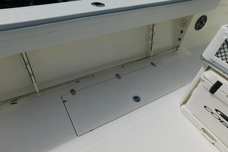 Slide: The Image of 2026 Cobia 285 Center Console boat interior with storage and seating features. - 17