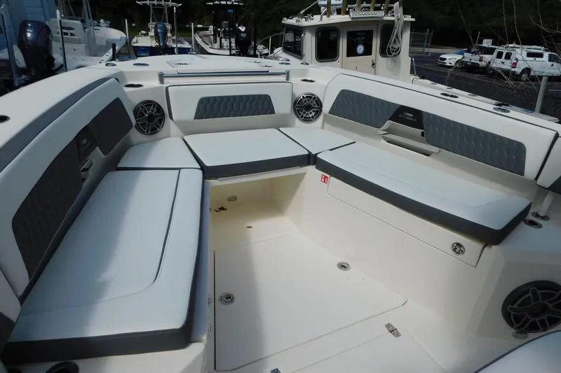 Slide: The Image of 2026 Cobia 285 Center Console boat seats, featuring luxurious white upholstery and ergonomic design. - 21