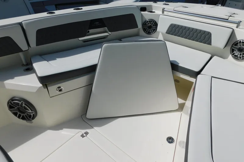 Slide: The Image of 2026 Cobia 285 Center Console boat interior with cushioned seating and sleek design. - 25