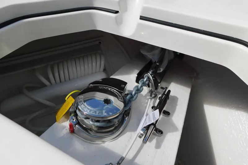 Slide: The Image of 2026 Cobia 285 Center Console boat interior with cushioned seating and speakers. - 26