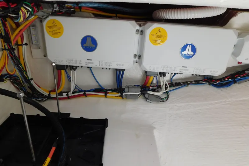 Slide: The Image of Electrical wiring and components inside a 2026 Cobia 285 Center Console boat. - 28