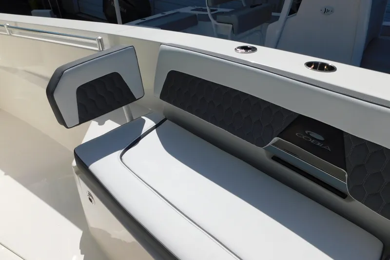 Slide: The Image of 2026 Cobia 285 Center Console boat seating with hexagonal pattern upholstery. - 35