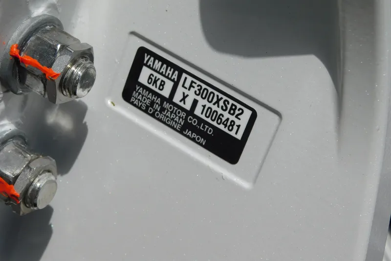 Slide: The Image of Close-up of Yamaha motor label and bolts on 2026 Cobia 285 Center Console. - 57