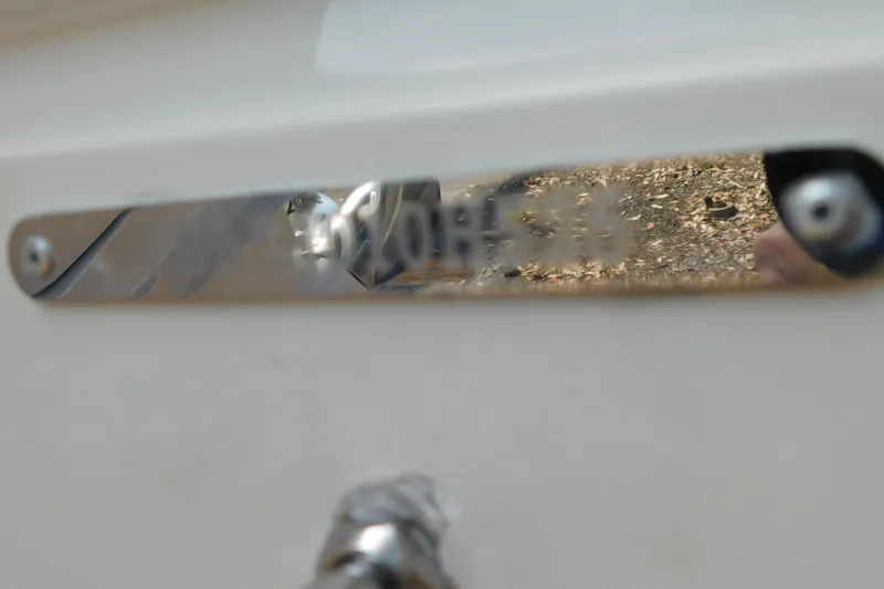 Slide: The Image of Close-up of a 2026 Cobia 285 Center Console nameplate on a boat. - 59